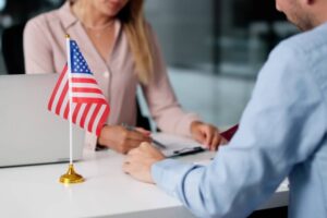 Young Couple Meets With Immigration Attorney At US Embassy For Visa.
